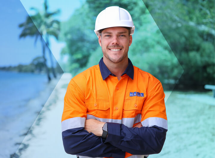 Hall employee standing on beach
